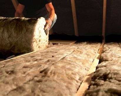 Loft insulation being fitted